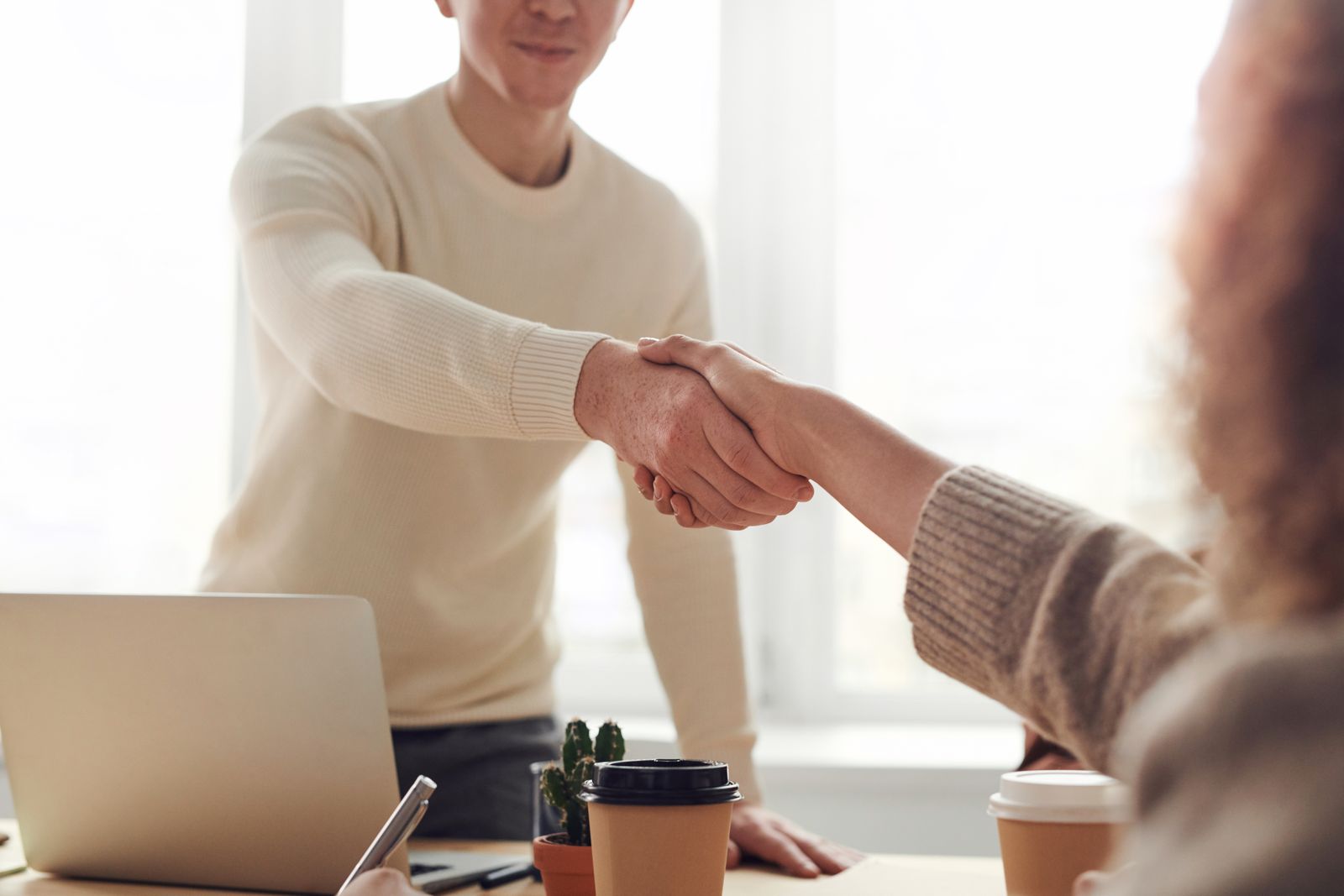 Loan advisor shaking hands with a client